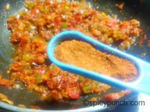 adding pav bhaji masala with the veggies