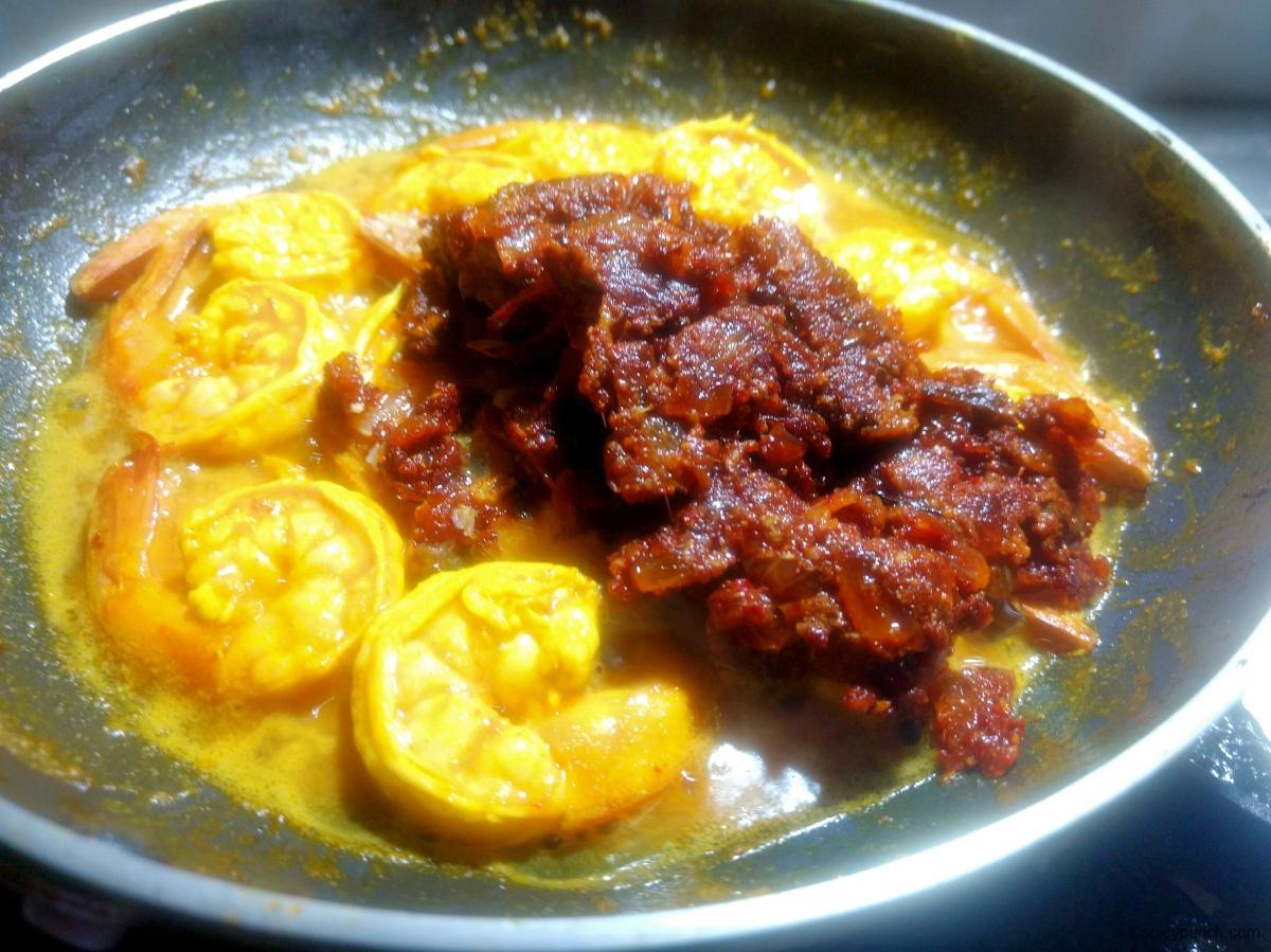 frying prawns with masalas for prawn ghee roast