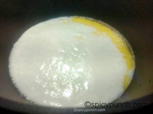 water, milk, ghee mix with salt is boiling for making rice dough of modak