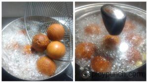 Fried gulab jamun in boiling sugar syrup