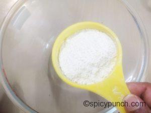 adding flour to the bowl for making homemade tempura flour for making Japanese tempura prawns