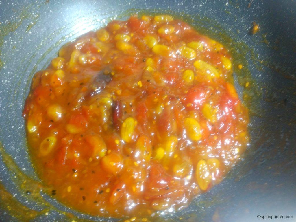 tomato khejur chutney or tomato and date chutney with a thick gravy