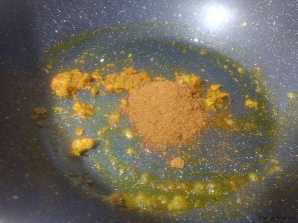 adding bhaja masala for vegetable chop to the pan for making this vegetable chops recipe or veg chop recipe