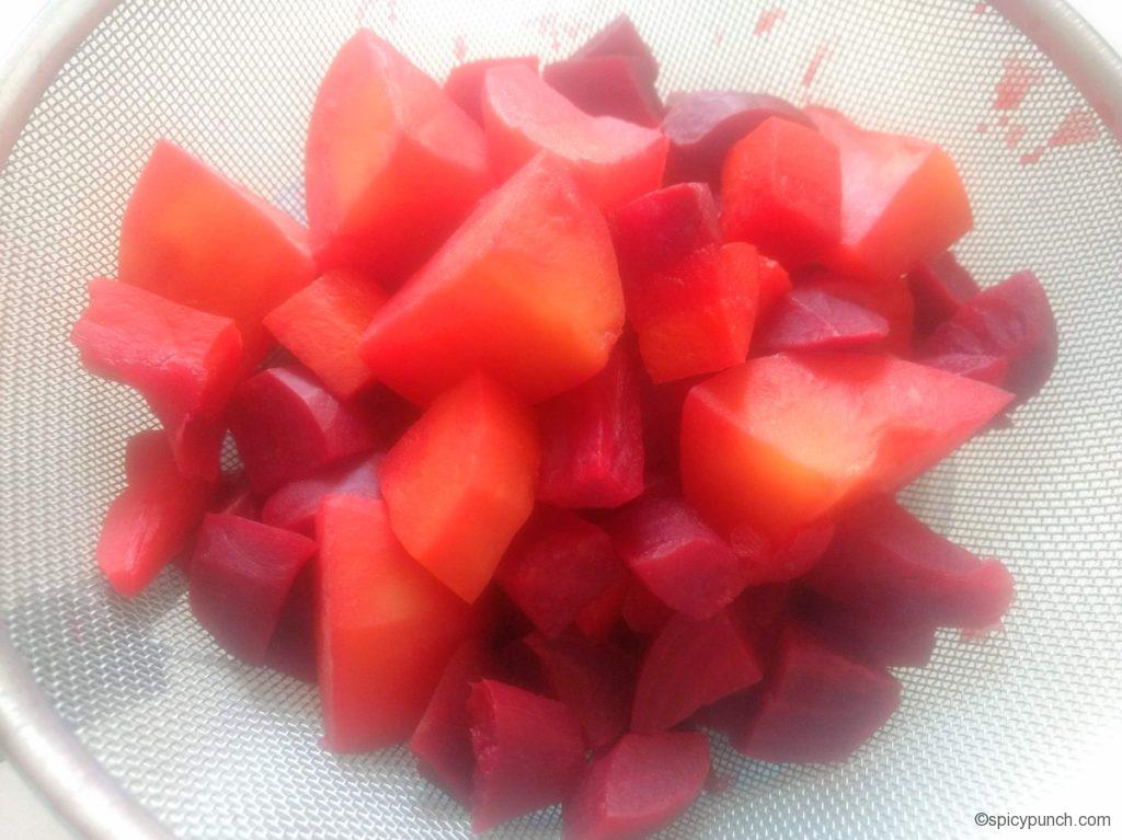 boiled veggies on the strainer to remove the excess water for making vegetable chop recipe bengali style or vegetable chop oriya recipe with the veggies